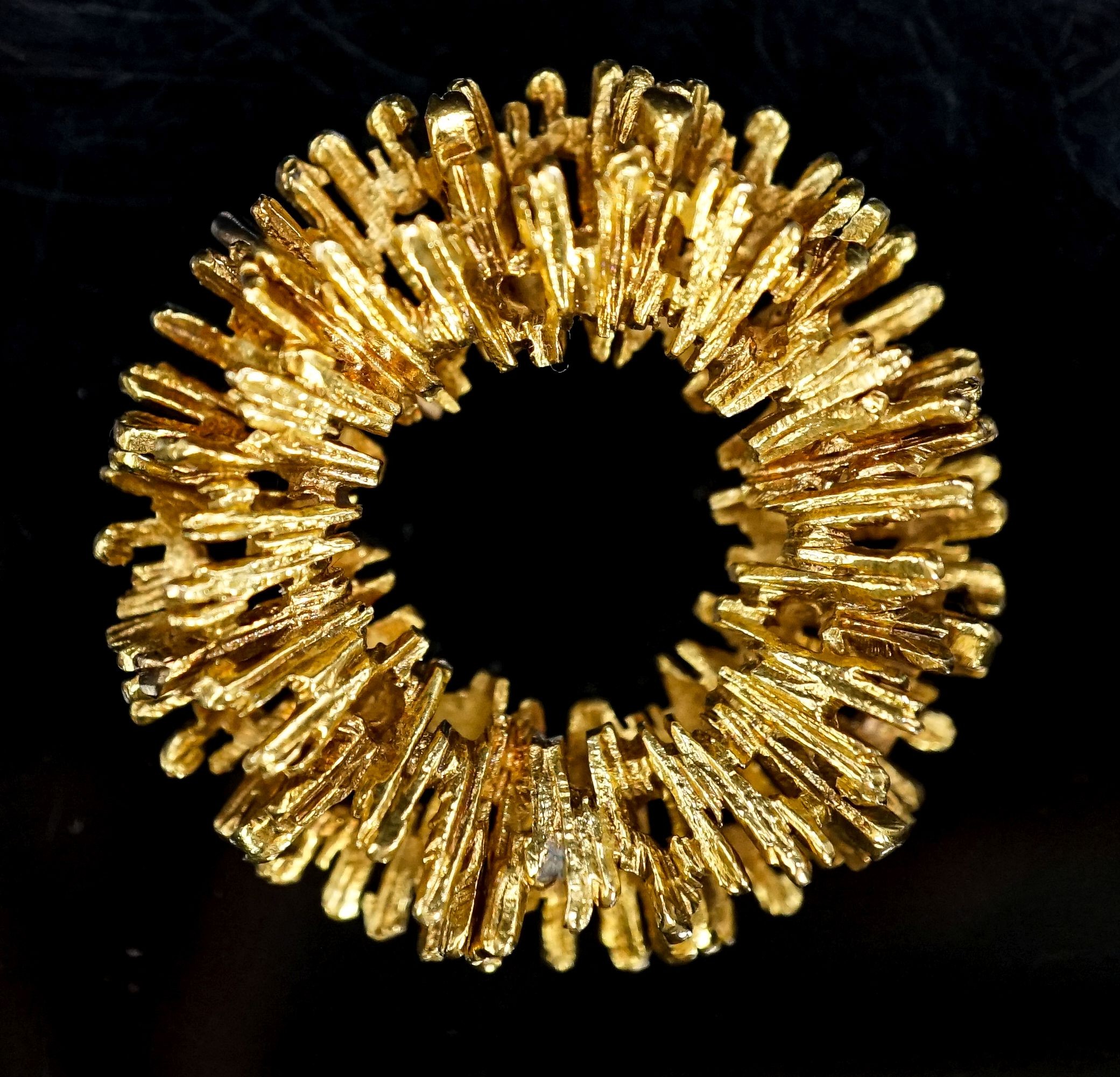 A 1970's textured 18ct gold modernist circular pendant, 35mm, 16 grams.